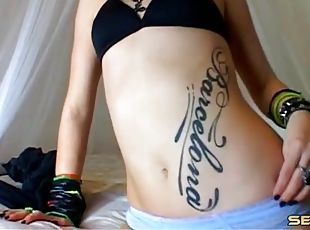 Tattooed camgirl turns you on with a sexy striptease