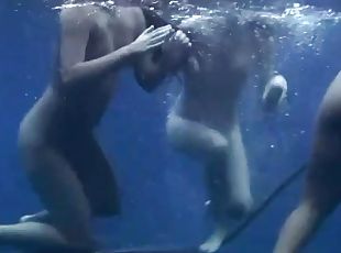 Three girls jump off the boat and go swimming