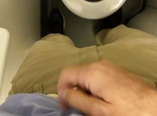 Business man touches himself and jerks off in the bathroom on a pla...