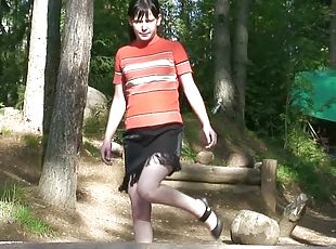 Pretty girl pissing outdoors in short skirt