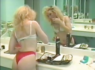 Horny blonde penetrates her wet pussy with a dildo in vintage clip