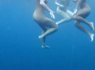 Luscious honeys love undressing while diving in the water