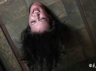 BDSM porn shoot of brunette slave yelling when spanked