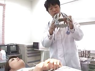 A doctor tests his Asian patient by teasing her tits and toying her...