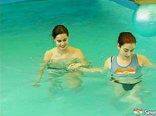 Salacious lesbians fondling in the pool before sharing a double end...
