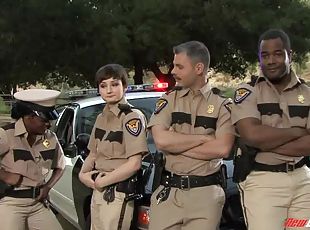 Pretty police woman attracted to a black male counterpart getting cozy at the station