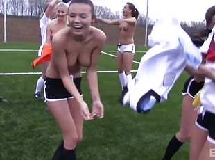 Soccer girls practicing and stripping down on the soccer field