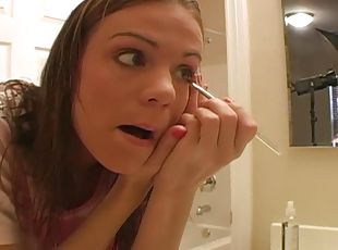 Cute teen does her makeup and talks dirty