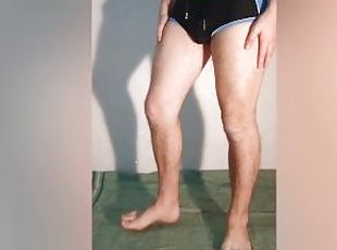 The guy shows what a chastity belt looks like under his clothes - a chastity cage in swimming trunks
