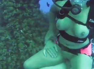 Nasty girl in a diving equipment has a sex on a sea bottom