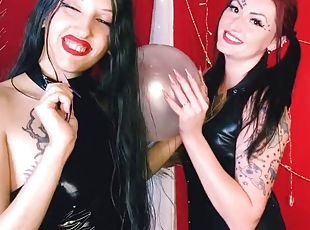 Balloon fetish. Two Mistresses blow up a balloon, play with their l...