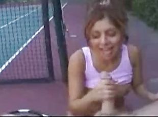 Tennis girl gives handjob on the court