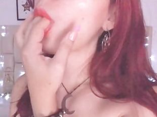 Sexy Colombian gamer girl with glasses plays with her fingers in he...