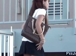 Asian pees in public park