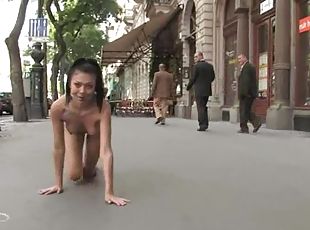 Divine brunette puts on a head harmess and gets fucked in public