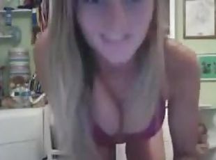 A pretty girl fingers her pussy in front of the webcam