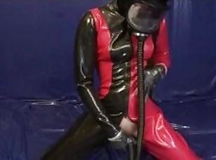 Young Latex Pissing Girl With Rubber Gasmask And Sniffing Pussy Dildo