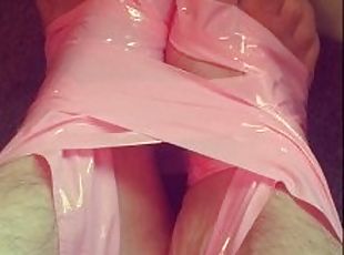Binding my feet and ankles with pink latex bondage tape for the fir...