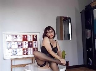 Regina Noir trying on high heels. Striptease in dark lingerie and s...