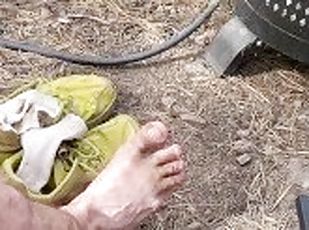 Coach SilverFox cleans his feet after a long day of hiking