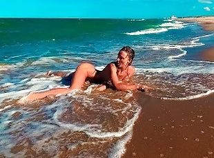 Stunning nudist girl having fun on the public beaches of Valencia