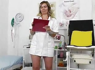 Nurse legs open and the mature pussy between them comes into view