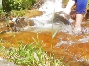 Sexy girl risky Crossing a mountain stream without taking off her s...