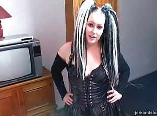 A wild goth girl with crazy hair shows off her handjob skills