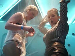 Hot girls kissing and dancing in a shower on a club stage