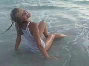 Amateur blonde teen naively poses in Wet T-shirt on the beach