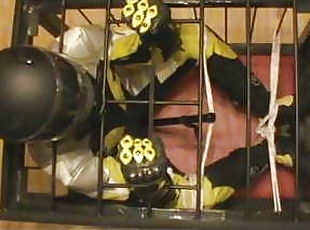 Caged bikerslave is restrained