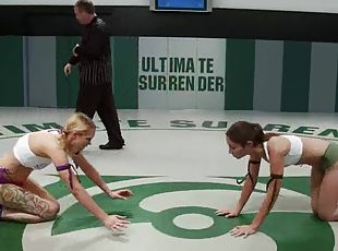 Tattooed blonde gets her cunt smashed during a fight on tatami