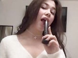 Sucking a black toy cock