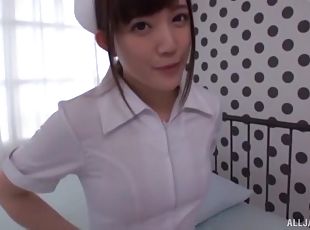 Foxy nurse Sazanami Rino spreads her legs to ride on the bed