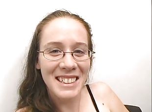 Nerdy girl in glasses gives a blowjob in an office