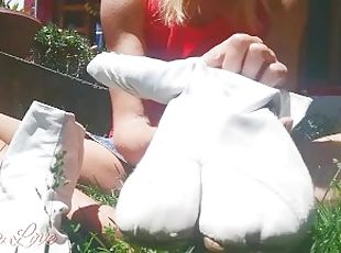 Girl puts on her white ninja shoes in the yard - Abella Love full v...