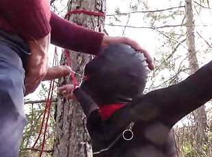 Tied to a tree on a sexy outfit, masked and outdoor deepthroat with...