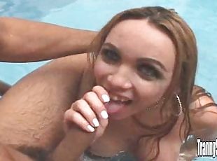 Blonde ladyboy Izabelly blows in a pool and gets her butt banged