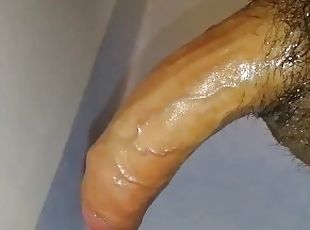 Oily uncircumcised tiny penis gets a quickie jerkoff into a slow motion wall shot cum splurge!