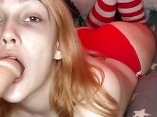 Beauty with a cute face gives a blowjob on a rubber cock