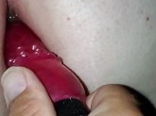 Hubby putting a toy in my ass