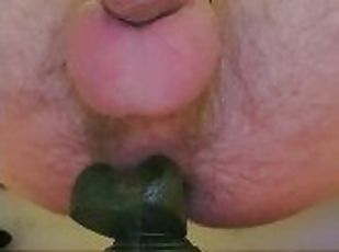 Locked cock ring and dildo making the cock drip