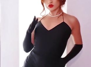 Solo darling wearing black dress enjoys while fingering her cunt