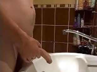 I peed into the sink and masturbated my dick while my wife was in t...