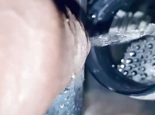 Pissing into the 500ml full bottle at a stretch  in the sink with c...
