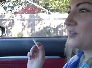 Amateur video of stranger Lily Adams smoking a cigar in the car