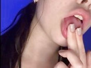 Juicy brunette licks her fingers