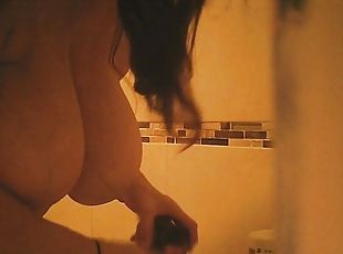 Busty lady spends her evening in the bathroom