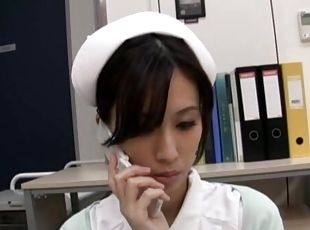 Horny Japanese nurse Anna Noma moans while playing with a dildo