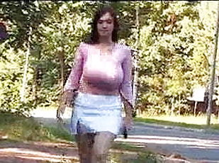Brunette with huge tits flash on public